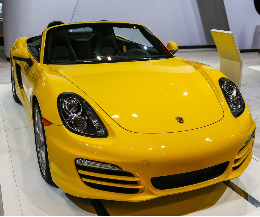 epa04060479 A 2014 Porsche Boxter is displayed during the media preview for the Chicago Auto Show at McCormick Place in Chicago, Illinois, USA, 07 February 2014. The show opens to the public on 08 Feb ...