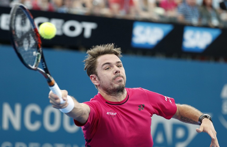 epa05702592 Stan Wawrinka of Switzerland in action against Kei Nishikori of Japan during their semifinal match at the Brisbane International Tennis Tournament in Brisbane, Queensland, Australia, 07 Ja ...