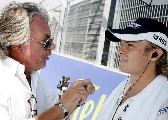 epa05656506 (FILE) A file picture dated 24 August 2008 of German Formula One driver Nico Rosberg (R) of Williams talking with his father Keke Rosberg (L) before the start of the Grand Prix of Europe a ...