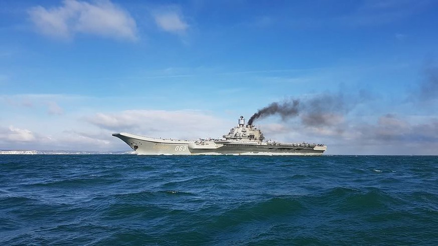 epa05596275 A handout photograph made available by Dover Marina.com on 21 October 2016 showing Russian aircraft carrier Admiral Kuznetsov with the White Cliffs of Dover in the background in the Englis ...