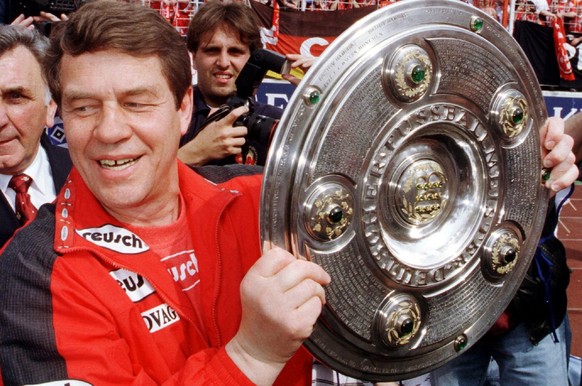 HBG30-19980509-HAMBURG, GERMANY: German Soccer League&#039;s team 1. FC Kaiserslautern&#039;s coach Otto Rehhagel proudly holds the German Soccer League Champion&#039;s trophy, which the team was awar ...
