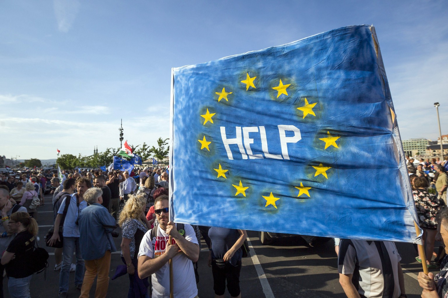 epa05979532 Supporters of Hungarys political opposition hold a banner during an anti-government protest entitled &#039;We do not give away our future, we stay here&#039; at Budapest University of Tec ...