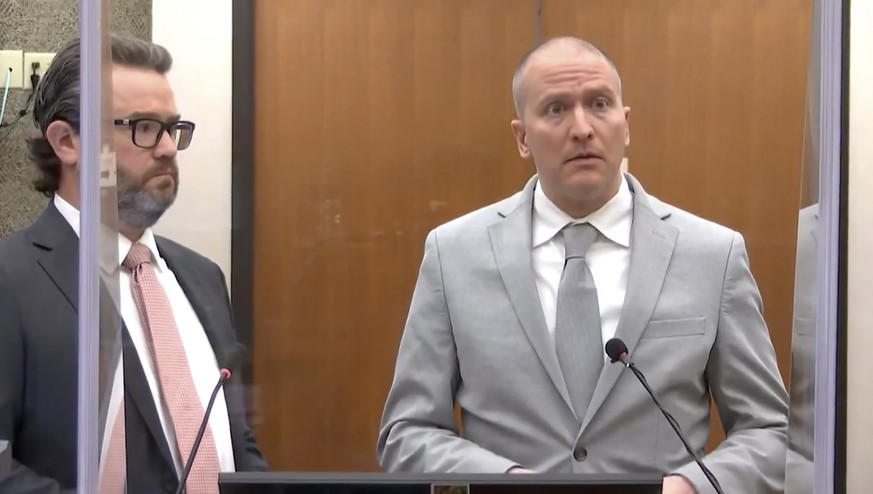 In this image taken from video, former Minneapolis police Officer Derek Chauvin, right, accompanied by defense attorney Eric Nelson, addresses the court as Hennepin County Judge Peter� Cahill presides ...