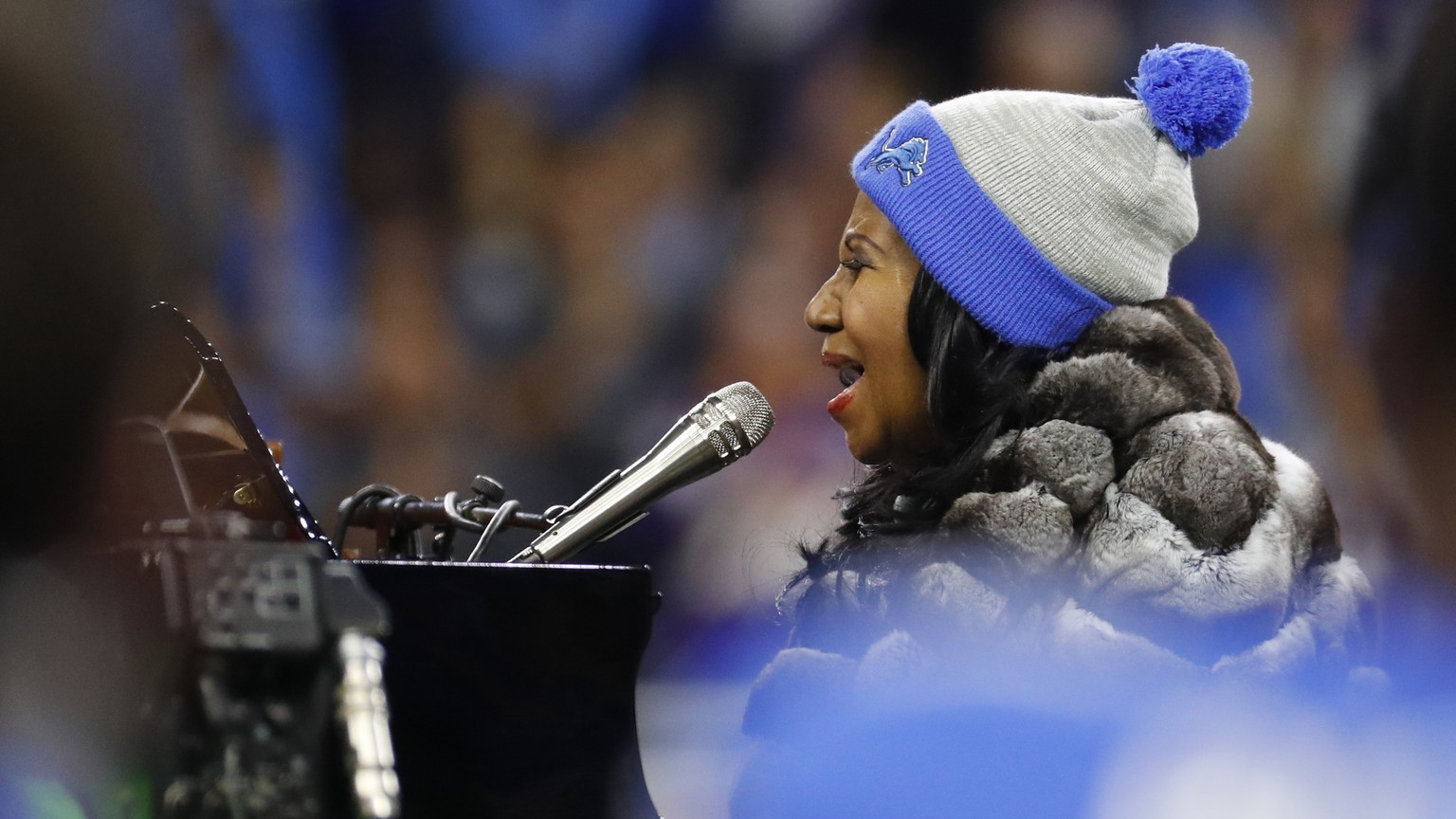 Aretha Franklin performs the national anthem before the first half of an NFL football game between the Detroit Lions and the Minnesota Vikings, Thursday, Nov. 24, 2016, in Detroit. (AP Photo/Rick Osen ...