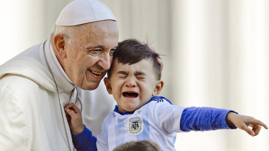 Pope Francis caresses a child as he arrives on his popemobile in St.Peter&#039;s Square for his weekly general audience at the Vatican, Wednesday, Oct. 10, 2018. (AP Photo/Gregorio Borgia)
