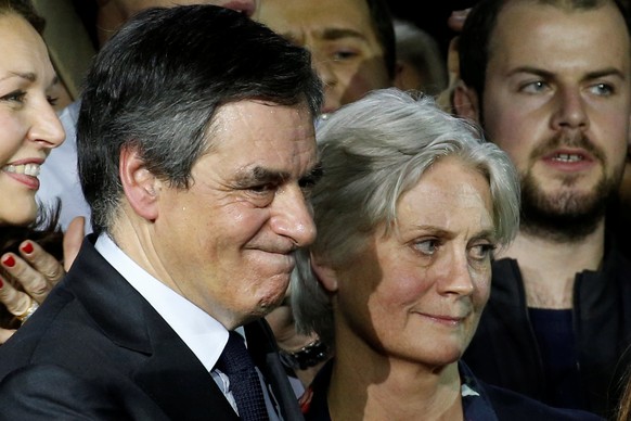 Francois Fillon, member of Les Republicains political party and 2017 presidential candidate of the French centre-right, and his wife Penelope attend a political rally in Paris, France, January 29, 201 ...