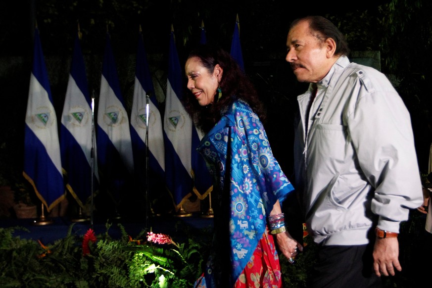 Daniel Ortega, Nicaragua&#039;s current president and presidential candidate from the ruling Sandinista National Liberation Front, holds hands with his wife and vice presidental candidate Rosario Muri ...