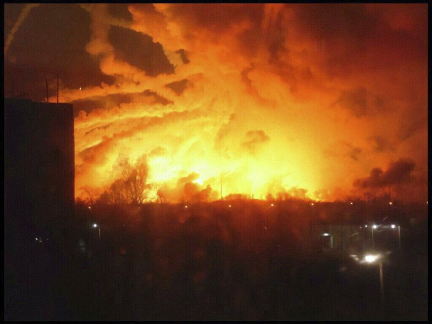 This photo provided by Ukrainian Emergency Situations Ministry press service a fire rages at a military ammunition depot in Balaklia near Khrakiv in Ukraine on Thursday, March 23 2017. There was no im ...