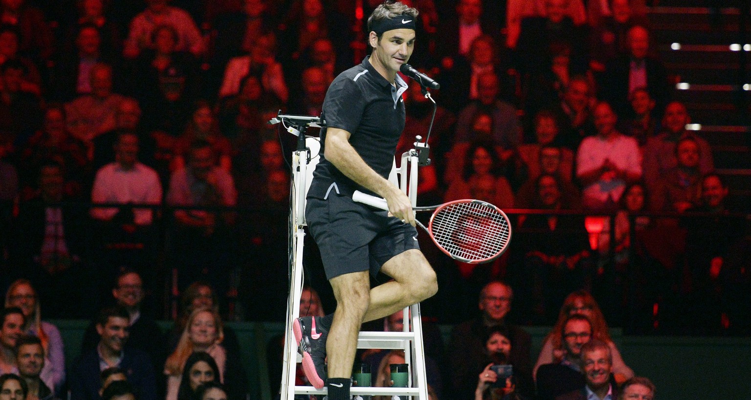 epa04537624 Roger Federer from Switzerland speaks to the spectators from the referee&#039;s chair during the Tennis exhibition &quot;Match for Africa 2&quot; against his compatriot Stan Wawrinka (unse ...