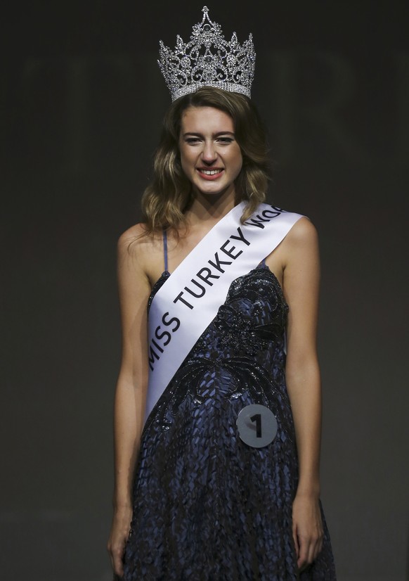 In this photo taken on Thursday, Sept. 21, 2017, Itir Esen, 18, smiles after being crowned as Miss Turkey 2017 in Istanbul. Organizers have stripped Miss Turkey 2017 of her crown over a social media p ...