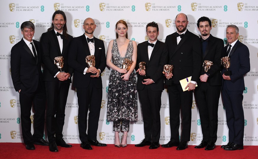 epa05789253 US actress Emma Stone (L) and director Damien Chazelle (R) pose in the press room after winning the award for Best Actress and Best Director for &#039;La La Land&#039; during the 2017 EE B ...