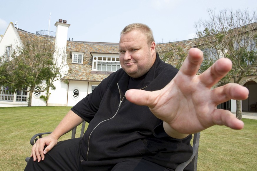 Kim Dotcom gestures towards a camera after an interview with Reuters in Auckland in this January 19, 2013 file photo. Nearly four years after dozens of black-clad police rappelled into his New Zealand ...