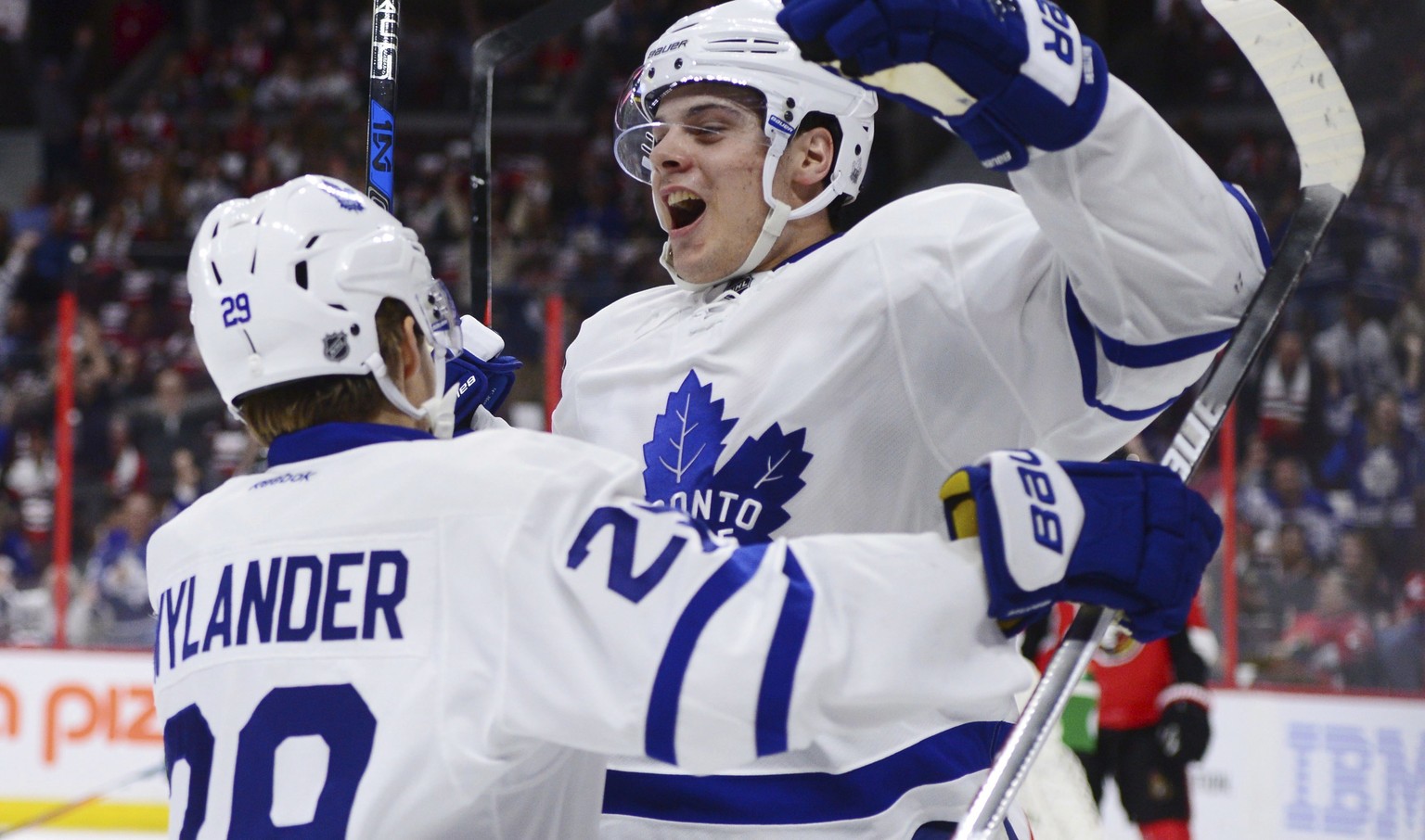 FILE - In this Oct. 12, 2016, file photo, Toronto Maple Leafs center Auston Matthews, right, celebrates a goal against the Ottawa Senators with teammate William Nylander during an NHL hockey game in O ...