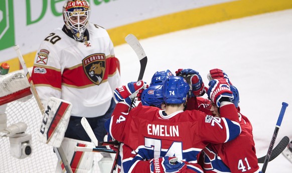 Montreal Canadiens center Tomas Plekanec (14) celebrates with teammates Alexei Emelin (74)Brendan Gallagher (11) and Paul Byron (41) in front of Florida Panthers goalie Reto Berra (20) after scoring t ...