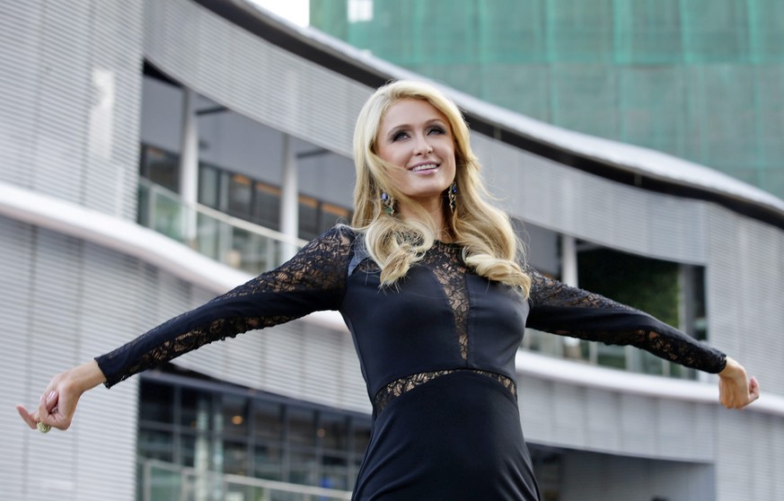 epa04123149 US personality Paris Hilton poses for photographers during the inauguration of the Paris Beach Club at Azure Urban Resort Residences in Paranaque City, south of Manila, Philippines, 13 Mar ...