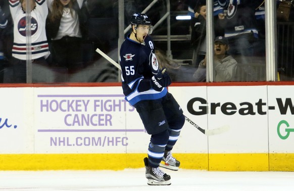 Nov 13, 2016; Winnipeg, Manitoba, CAN; Winnipeg Jets center Mark Scheifele (55) celebrates his overtime winning goal during the overtime period against the Los Angeles Kings at MTS Centre. Winnipeg wi ...