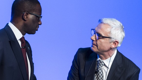 FILE --- Tidjane Thiam, left, CEO Credit Suisse, and Urs Rohner, right, chairman Credit Suisse, after an extraordinary general assembly in Bern, Switzerland, Thursday, November 19, 2015. Credit Suisse ...