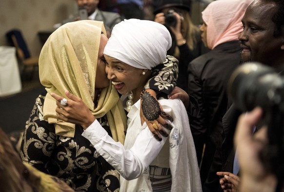 Ilhan Omar greets a supporter as she arrives to her victory party in Minneapolis, Minn., on Tuesday, Nov. 8, 2016. The Minneapolis community activist won a historic election, becoming the nation&#039; ...