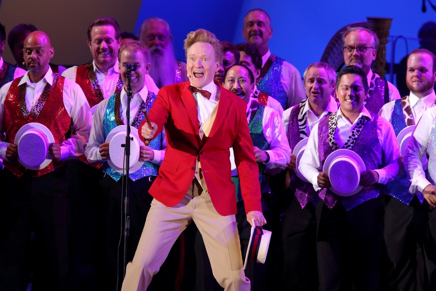 In this photo provided by the Hollywood Bowl, Conan O&#039;Brien performs &quot;The Monorail Song&quot; at the world premiere of &quot;The Simpsons Take the Bowl&quot; at the legendary concert venue F ...