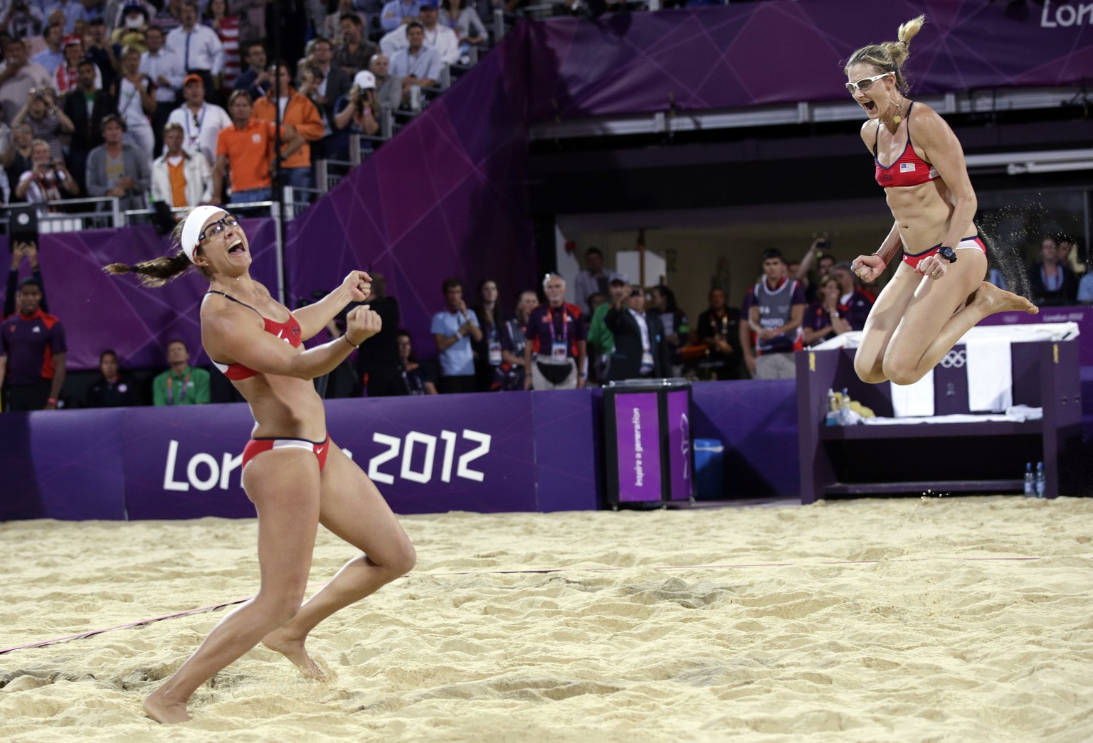 FILE - In this Aug. 8, 2012, file photo, Miss May Treanor, left, and Kerri Walsh Jennings celebrate a win over April Ross and Jennifer Kessy during the women&#039;s Gold Medal beach volleyball match a ...