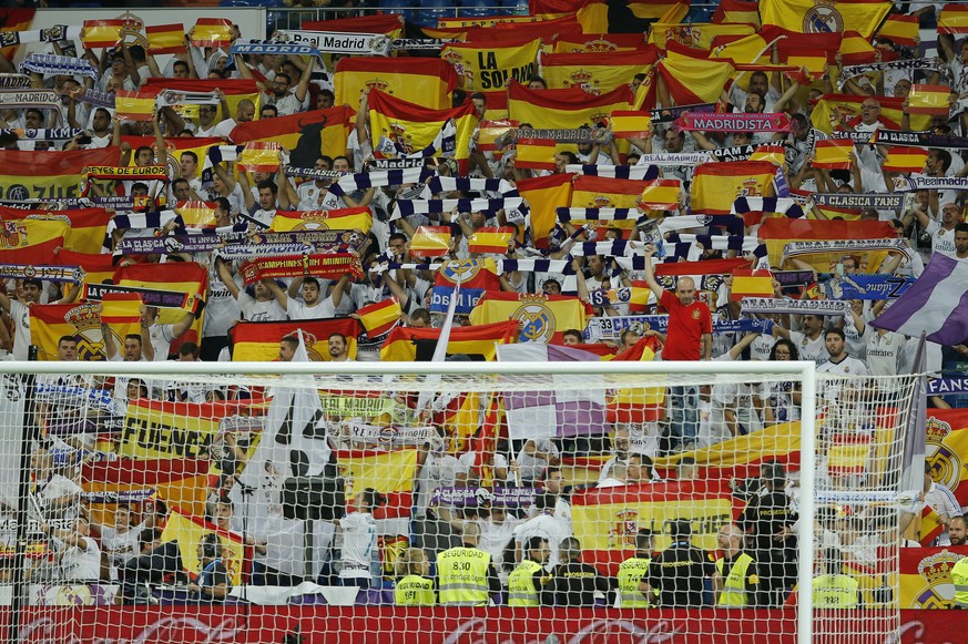 Real Madrid fans display Spanish national flags in support of a united Spain against the Catalonian referendum for independence, during a Spanish La Liga soccer match between Real Madrid and Espanyol  ...