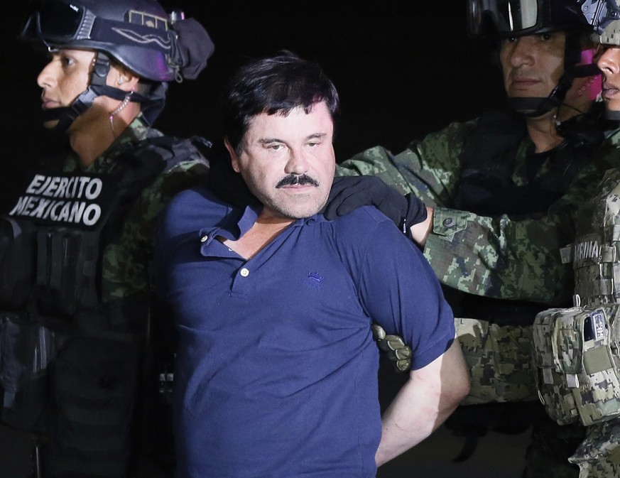 epa05600513 YEARENDER 2016 JANUARY

Alleged fugitive Mexican drug lord Joaquin &#039;El Chapo&#039; Guzman is escorted by the authorities to a Mexican Army helicopter in Los Mochis, Sinaloa, Mexico, ...