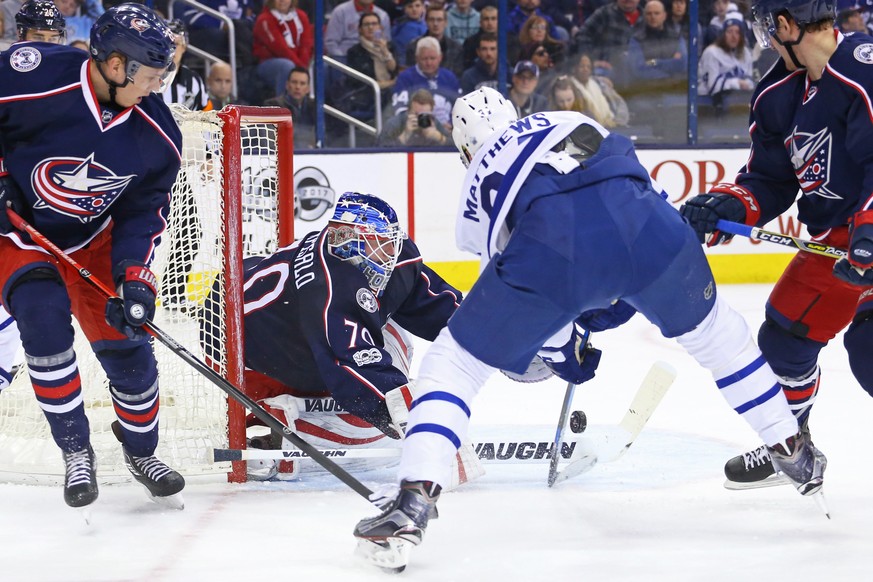 Mar 22, 2017; Columbus, OH, USA; Columbus Blue Jackets goalie Joonas Korpisalo (70) makes a save in net against Toronto Maple Leafs center Auston Matthews (34) in the first period at Nationwide Arena. ...