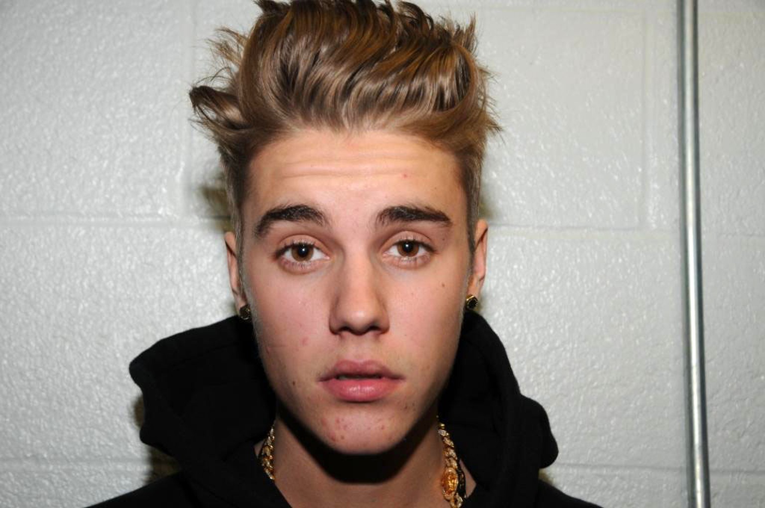 FILE - This Jan. 23, 2014 file photo made available by the Miami Beach Police Dept., shows Justin Bieber at the police station in Miami Beach, Fla. According to two people directly involved with the c ...