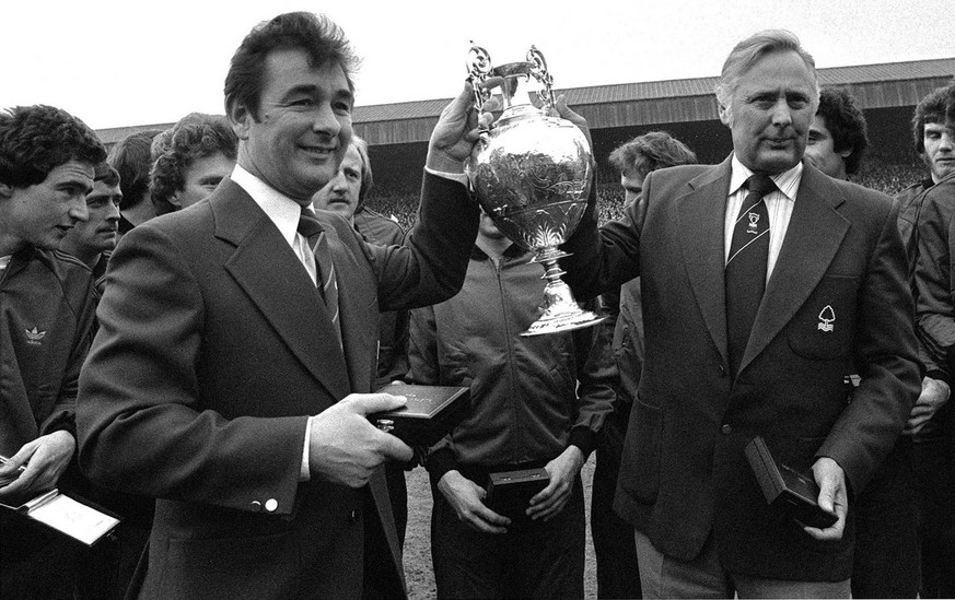 April 30, 1978 photo of Nottingham Forest soccer team manager Brian Clough, left, and assistant manager Peter Taylor, holding the English League Championship trophy after it had been presented to Fore ...