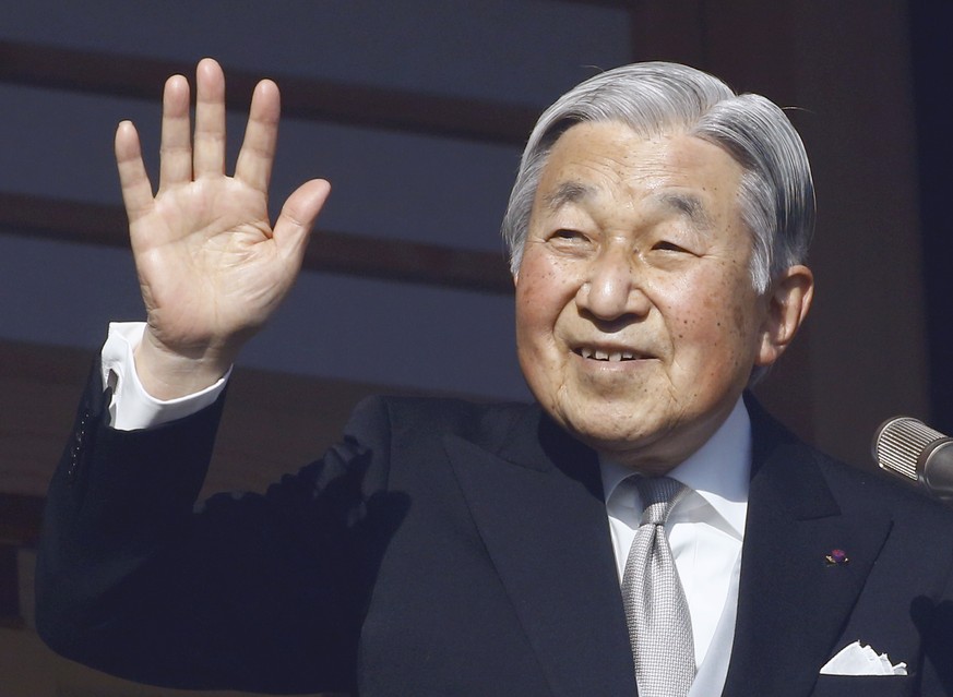 FILE - In this Jan. 2, 2017, file photo, Japan&#039;s Emperor Akihito waves to well-wishers from the palace balcony during a New Year&#039;s public appearance with his family members at the Imperial P ...