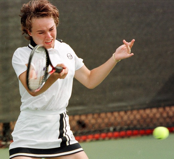 Switzerland&#039;s Martina Hingis returns to Japan&#039;s Ai Sugiyama during their second round match at the Stone Mountain Tennis Center Thursday July 25, 1996. Sugiyama defeated Hingis 6-4, 6-4 at t ...