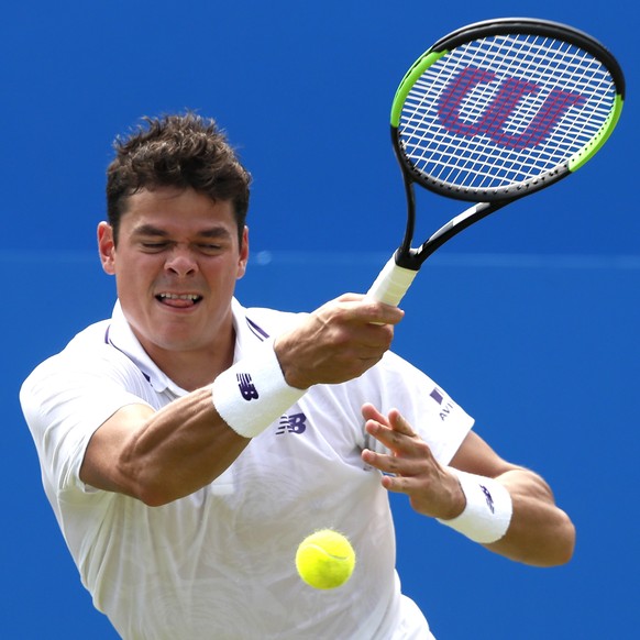 Milos Raonic of Canada plays a return to Thanasi Kokkinakis of Australia during day two of the Queen&#039;s Club tennis tournament in London, Tuesday, June 20, 2017. (AP Photo/Kirsty Wigglesworth)