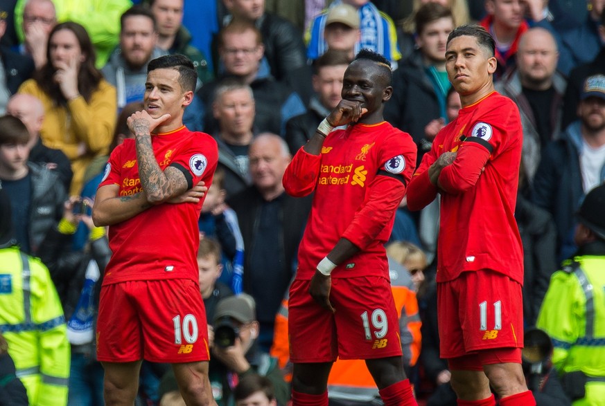 epa05882495 Liverpool’s Philippe Coutinho (L) celebrates scoring the third goal making the score 2-1 with Roberto Firmino (R) and Sadio Mane (C) during the English Premier League soccer match between  ...