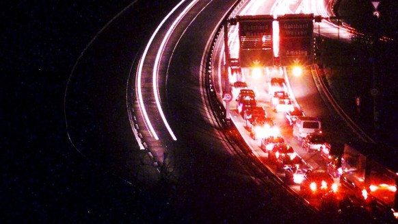 Due to heavy Easter traffic there was only stop an go for some kilometers for the many travellers on the northern side of the Gotthard highway A2 near Amsteg, Switzerland, Thursday night, April 12, 20 ...