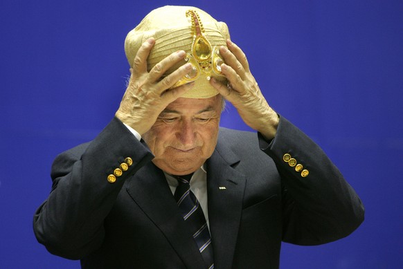 Federation of International football Association, FIFA, President Joseph Sepp Blatter, gestures after being presented with a traditional Indian headgear at the 70th Anniversary of Indian Football, in  ...