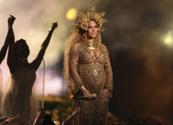 FILE - This Feb. 12, 2017 file photo shows Beyonce performing at the 59th annual Grammy Awards in Los Angeles. Beyonce and Jay Z, along with George and Amal Clooney, have announced recently that they  ...