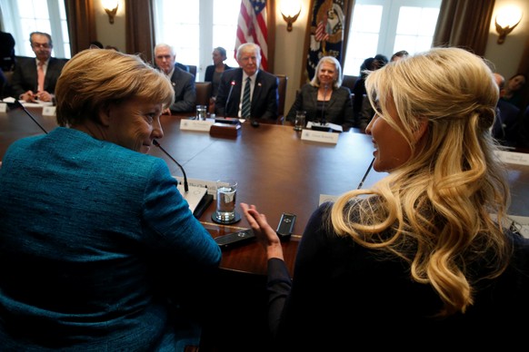 Germany&#039;s Chancellor Angela Merkel (L) and Ivanka Trump speak during a roundtable discussion between U.S. President Donald Trump and German and U.S. business leaders on vocational training at the ...