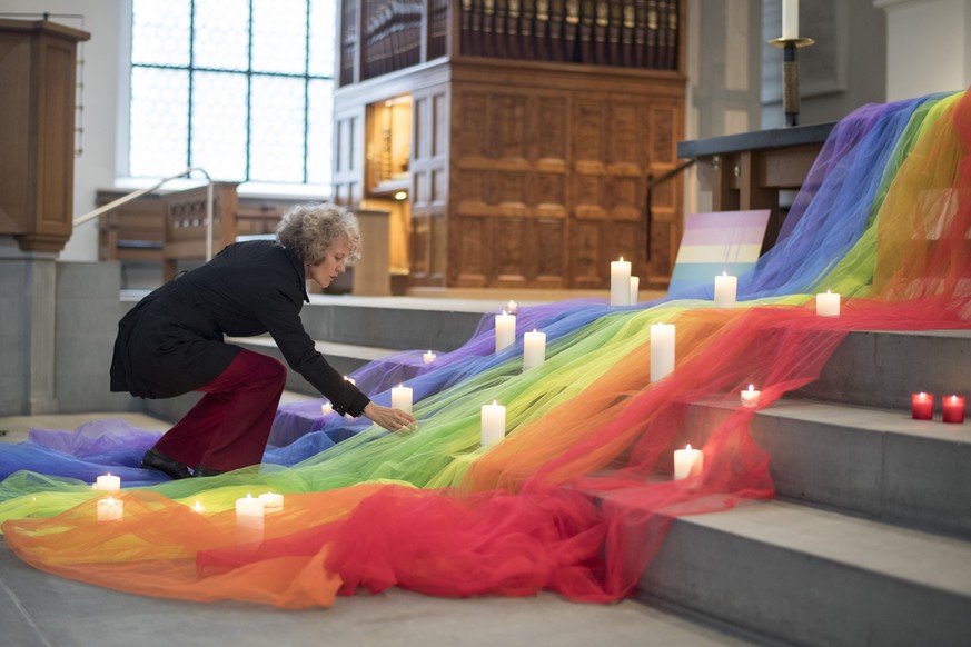 Corine Mauch, Mayor of Zurich, hold a vigil for those killed and wounded in the Sunday June 12, mass shooting at a gay nightclub in Orlando, at a church in Zuerich, Switzerland, Monday, June 13, 2016. ...
