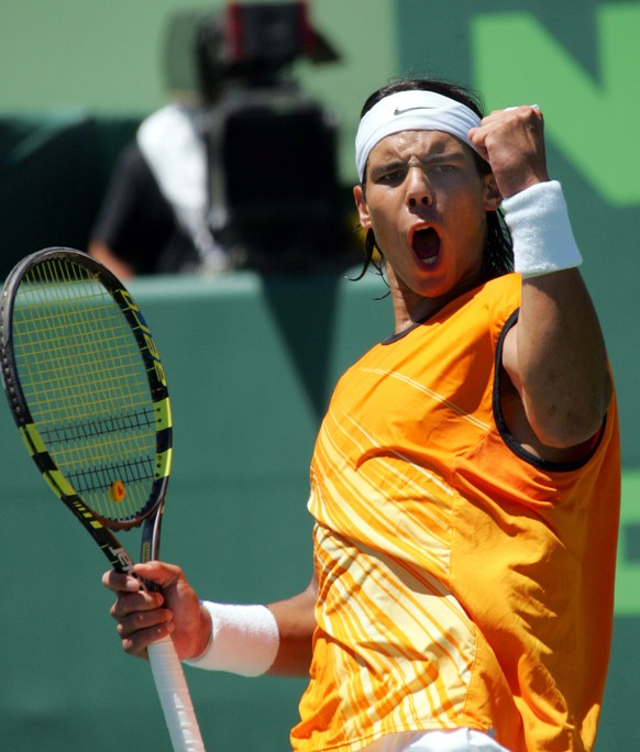 Roger Federer of Switzerland celebrates a point during his match against Andre Agassi of the USA during their semifinal match at the Nasdaq-100 Open in Key Biscayne, Florida Friday 01 April 2005. Fede ...