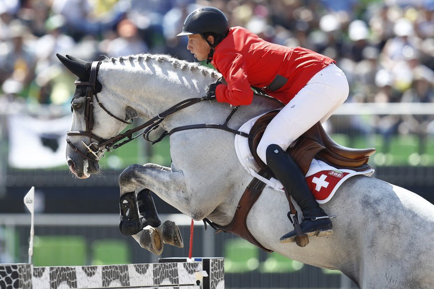 Switzerland&#039;s Martin Fuchs rides on his horse Clooney during the Jumping Team final of the Equestrian competition at the Olympic Equestrian Centre at the Rio 2016 Olympic Summer Games in Rio de J ...