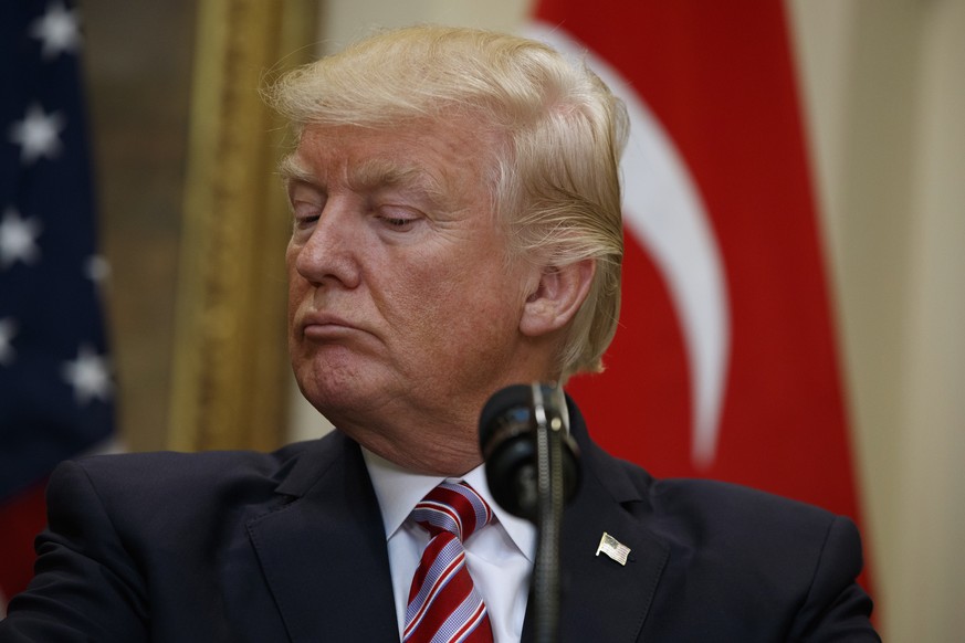 President Donald Trump listens as Turkish President Recep Tayyip Erdogan speaks in the Roosevelt Room of the White House in Washington, Tuesday, May 16, 2017. (AP Photo/Evan Vucci)