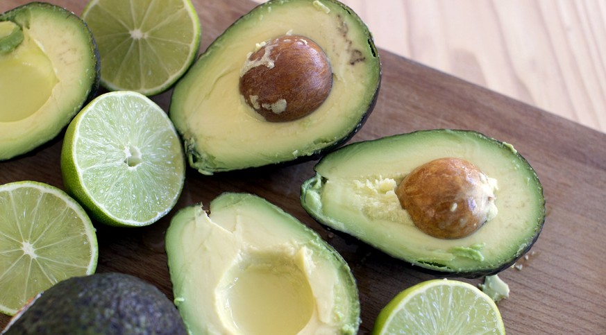 FILE - This Dec. 15, 2014 photo shows avocados and limes, key ingredients for guacamole in Concord, N.H. A New York Times article Wednesday, July 1, urged readers to pair peas with guacamole, causing  ...