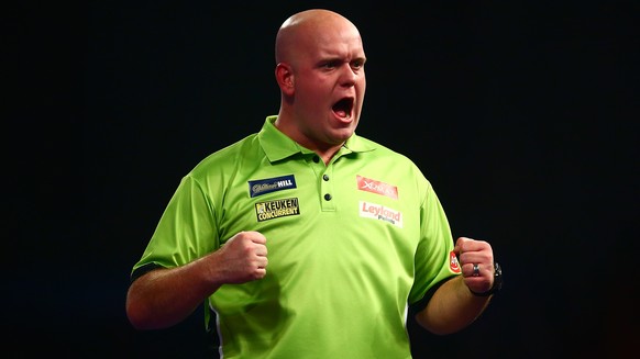 LONDON, ENGLAND - DECEMBER 29: Michael van Gerwen of Holland celebrates a point in his third round match against Raymond van Barneveld of Holland on Day Eleven of the 2016 William Hill PDC World Darts ...