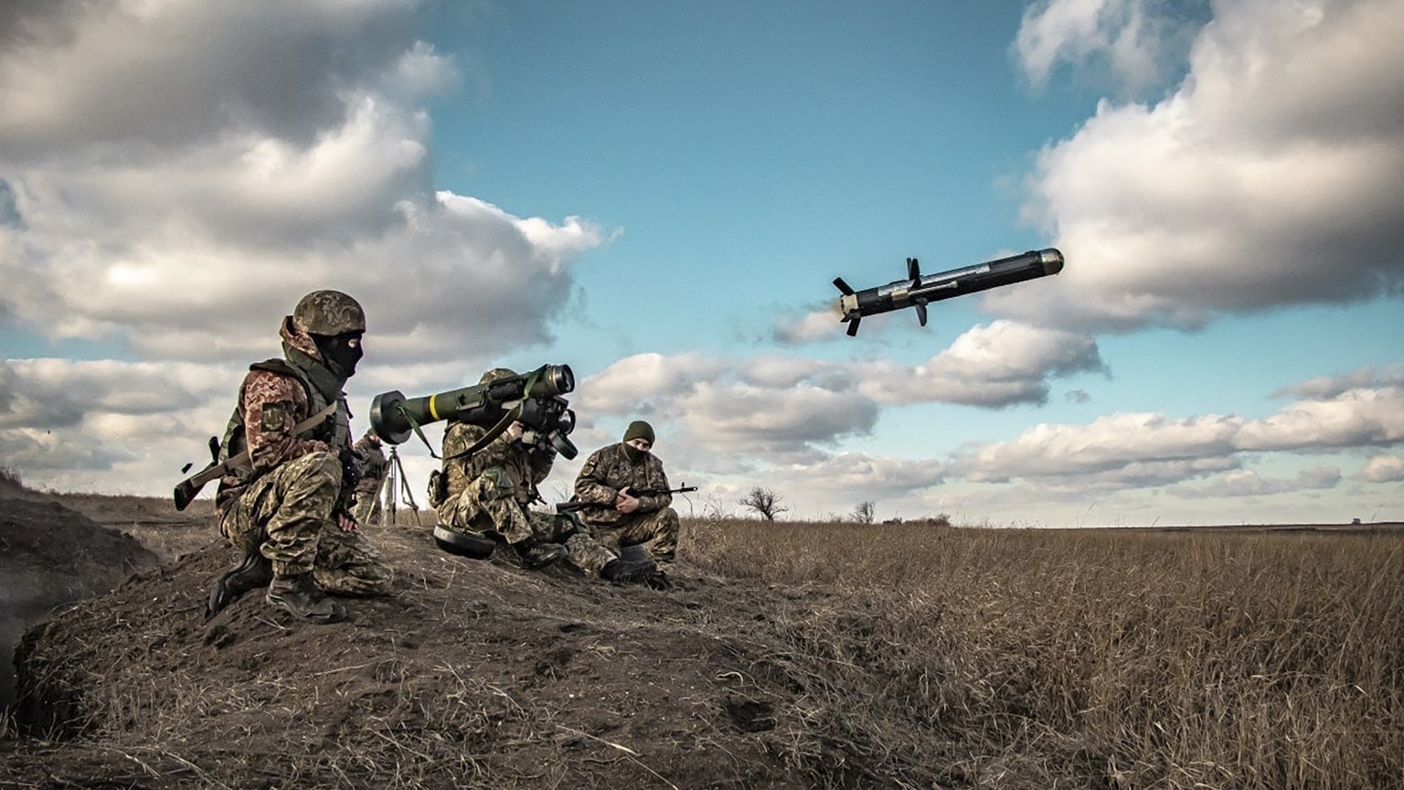 In this image released by Ukrainian Defense Ministry Press Service, Ukrainian soldiers use a launcher with US Javelin missiles during military exercises in Donetsk region, Ukraine, Thursday, Dec. 23,  ...