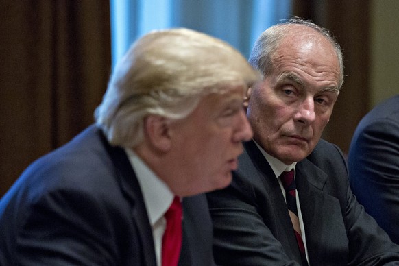 epa06247076 US President Donald J. Trump speaks as John Kelly, White House chief of staff, (L) listens during a briefing with senior military leaders in the Cabinet Room of the White House in Washingt ...