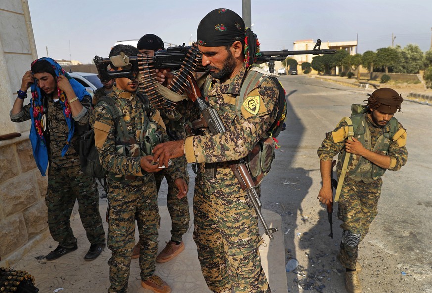 In this Saturday June 22, 2017 photo, U.S.-backed Syrian Democratic Forces (SDF) fighters, prepare for battle against Islamic state group militants, in Raqqa, northeast Syria. Several weeks ago, the S ...