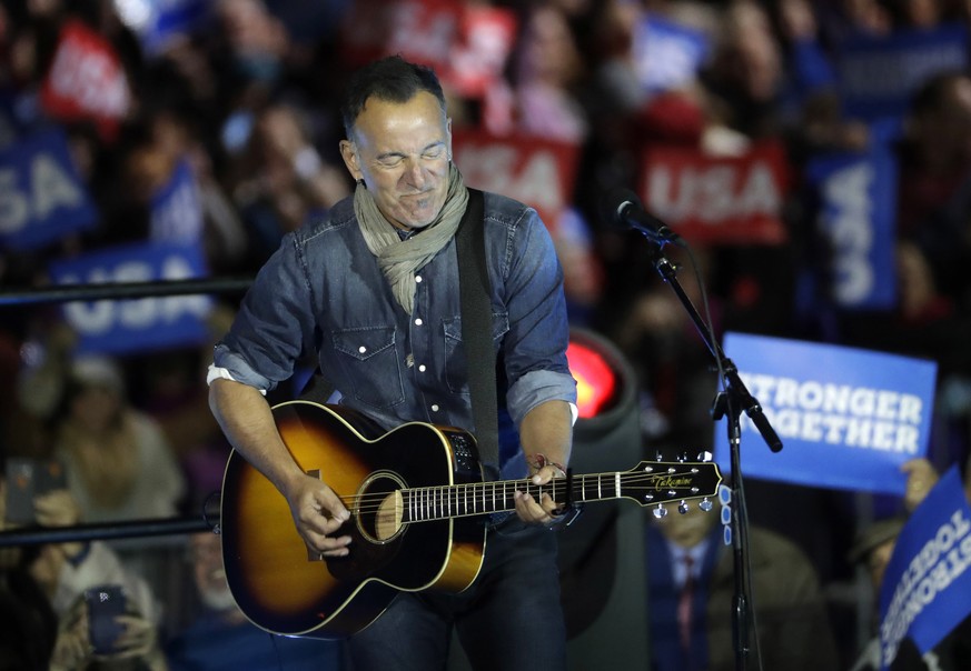 Bruce Springsteen performs during a Hillary Clinton campaign event at Independence Mall on Monday, Nov. 7, 2016 in Philadelphia. (AP Photo/Matt Slocum)