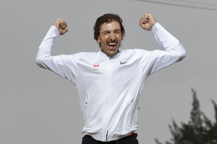 Gold medalist Fabian Cancellara of Switzerland celebrates on the podium of the men&#039;s individual time trial event at the 2016 Summer Olympics in Pontal beach, Rio de Janeiro, Brazil, Wednesday, Au ...