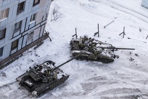Ukrainian tanks stand in the yard of an apartment block in Avdiivka, eastern Ukraine, Wednesday, Feb. 1, 2017. Heavy fighting around government-held Avdiivka, just north of the rebel-stronghold city o ...