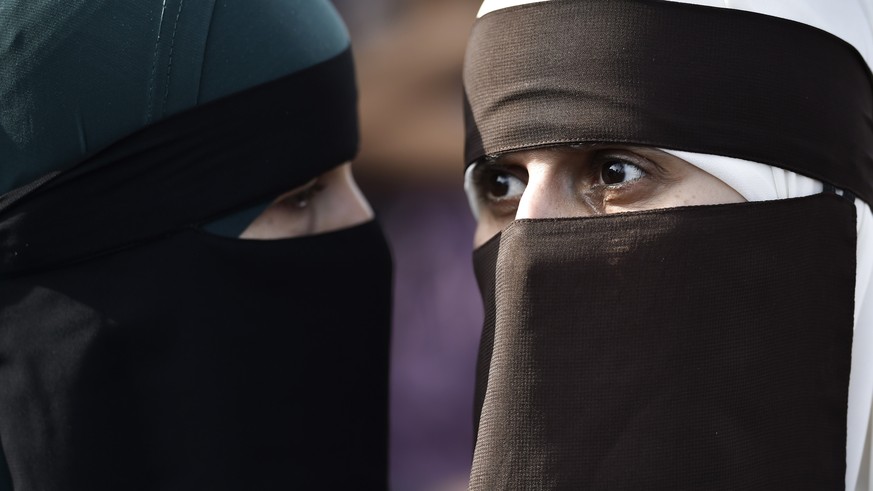 epa06922108 Face covered women protest in Copenhagen, Denmark, 01 August 2018, on the first day of the implementation of the Danish face veil ban. Under the new law, all apparel covering the face is f ...